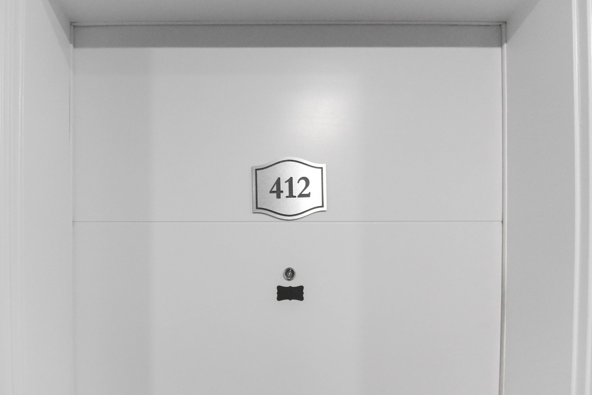 Entry door of a one bedroom suite at The Metro 1827