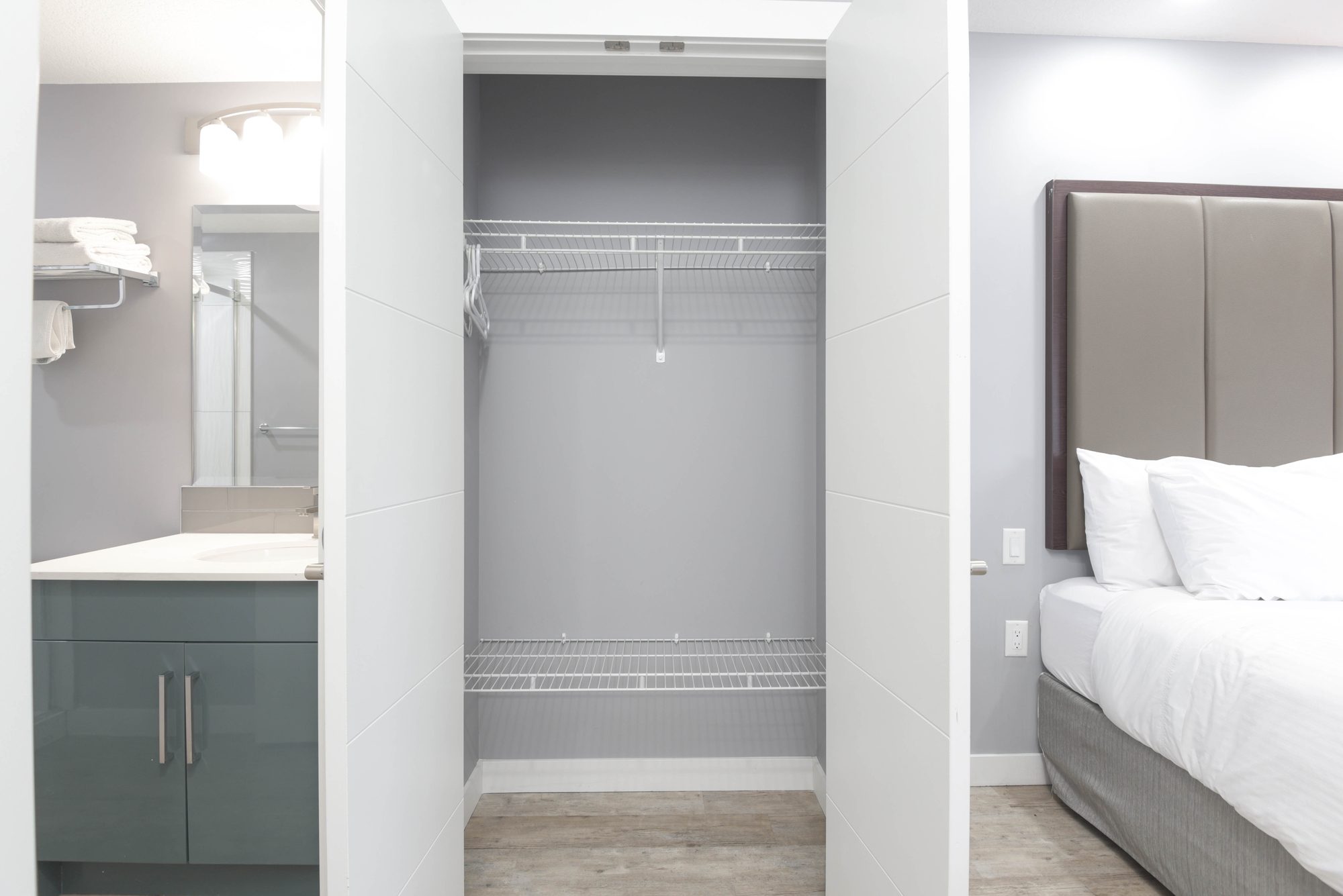 Closet and bathroom vanity off the bedroom hallway